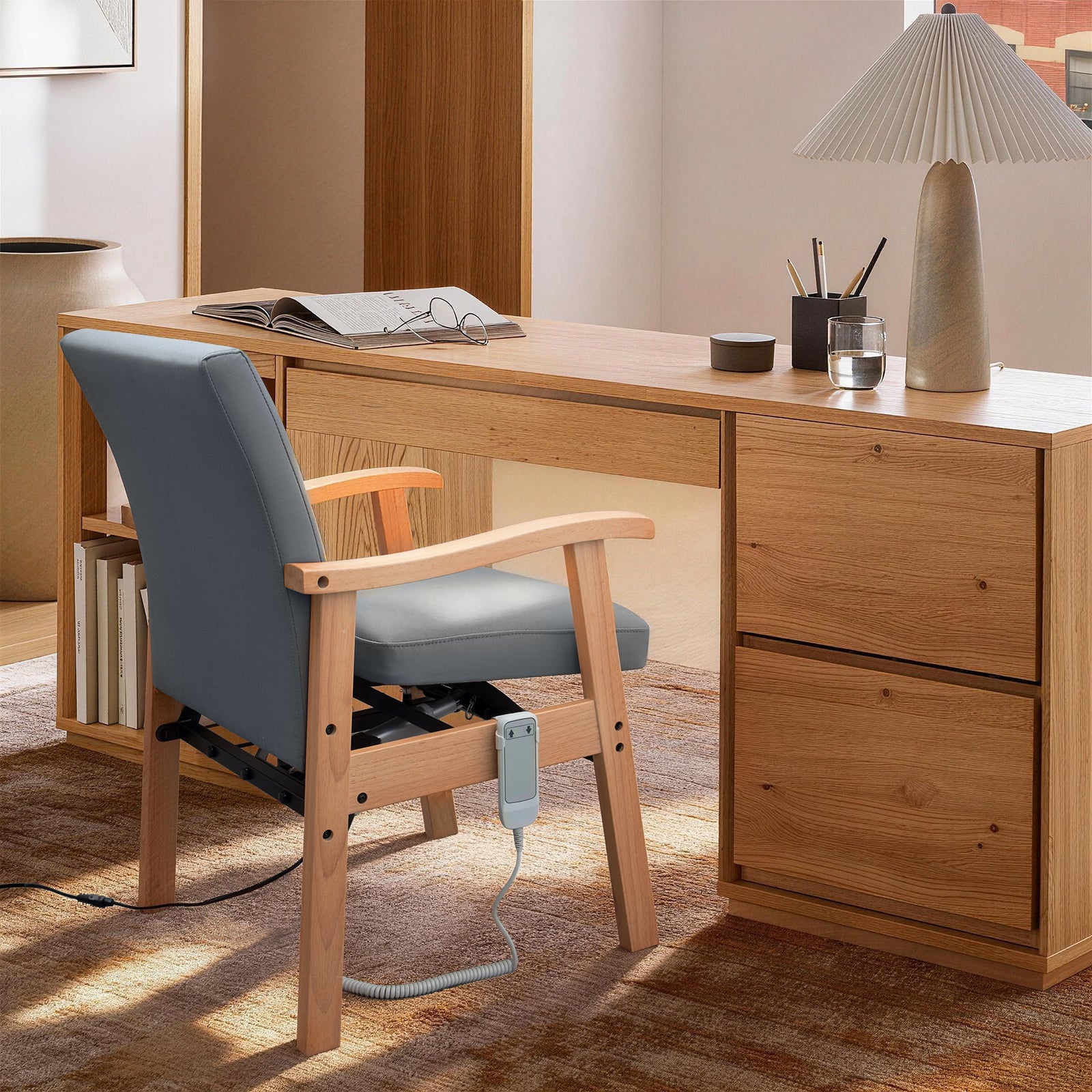 Gray leather power lift chair with wooden frame positioned at a home office desk