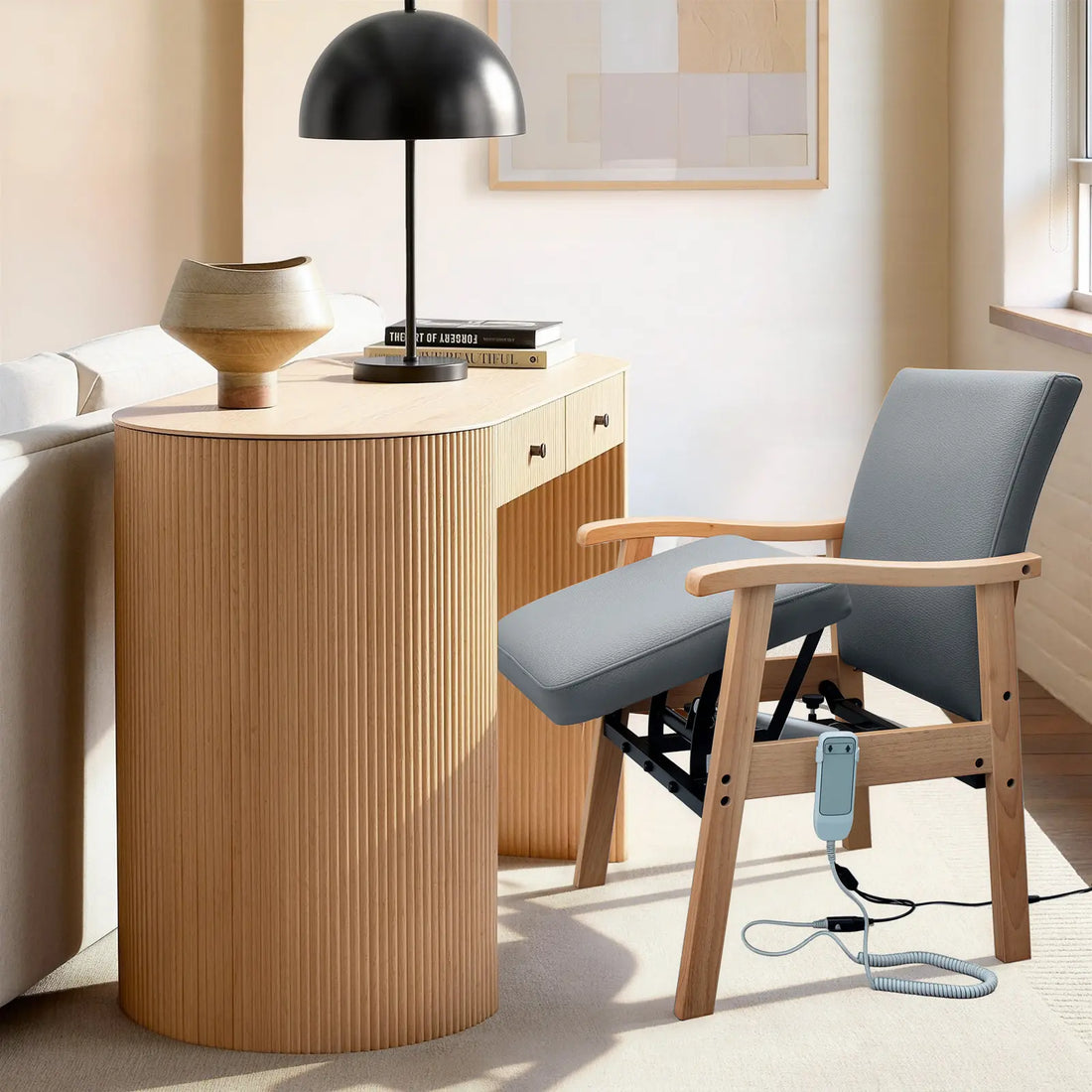 Gray leather power lift chair with solid wood frame placed beside a home desk